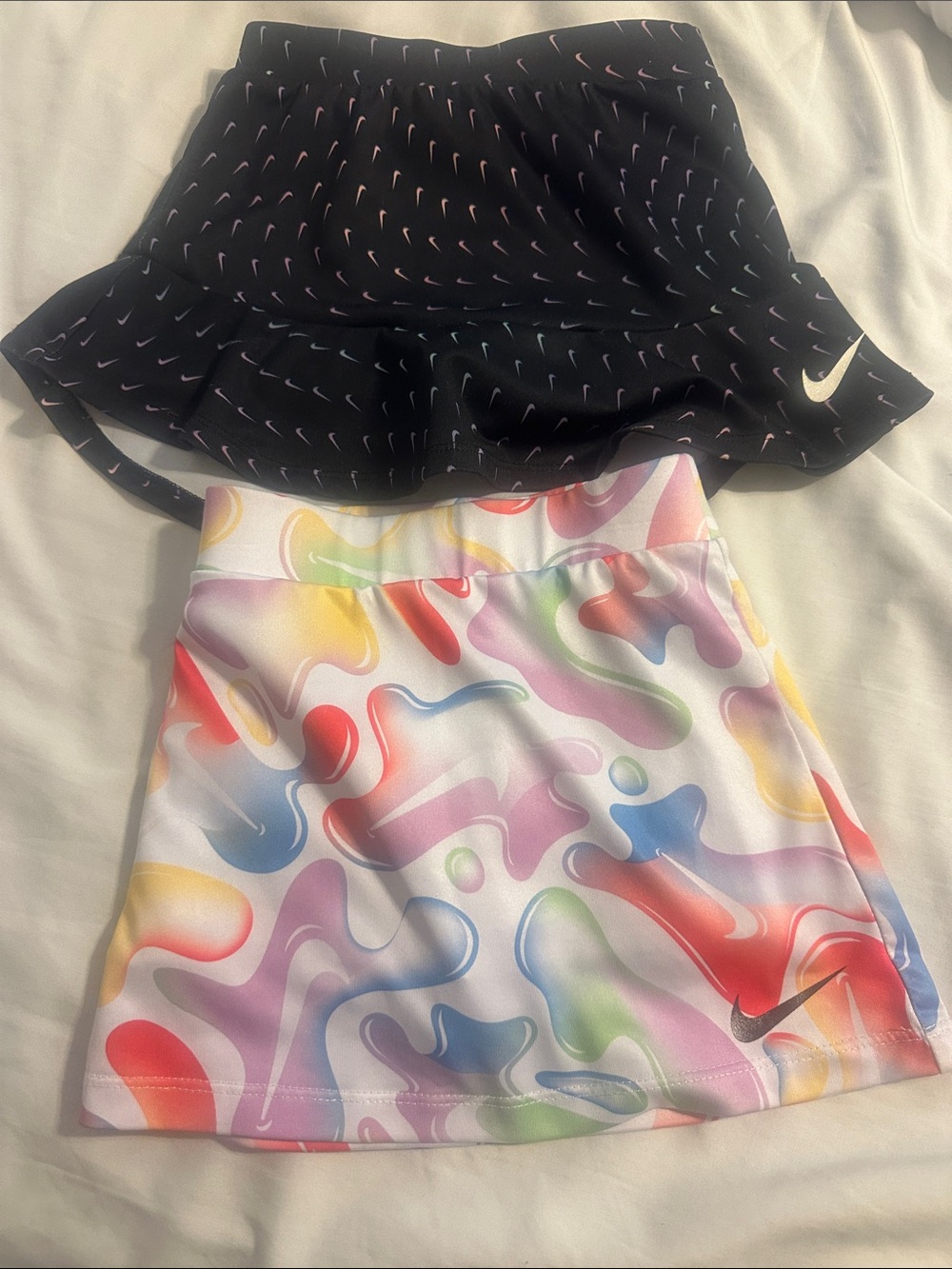 Nike Black Skort with Pink Swoosh Accents & Nike Multicolor Swirl A-Line Skirt
